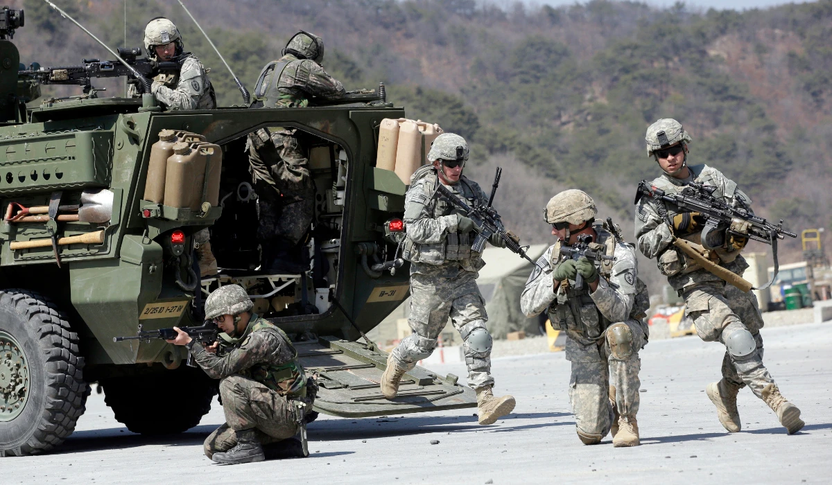 In this March 25, 2015, file photo, US Army soldiers from the 25th Infantry Division's 2nd Stryker Brigade Combat Team and South Korean soldiers take their position during a demonstration of the combined arms live-fire exercise as a part of the annual joint military exercise Foal Eagle between South Korea and the United States at the Rodriquez Multi-Purpose Range Complex in Pocheon, north of Seoul, South Korea. (AP)