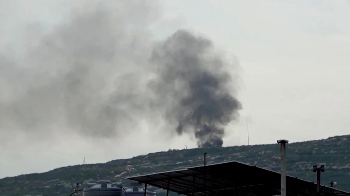 Black smoke rises from a site believed to have been hit by an Israeli strike, in southern Lebanon, in this screen grab taken from a video, February 27, 2024. (Reuters)