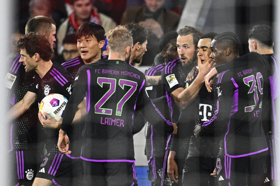 Munich’s goalscorer Jamal Musiala celebrates with teammates after scoring their side’s second goal of the game during their Bundesliga match against SC Freiburg at the Europa-Park Stadium in Freiburg Im Breisgau, Germany, on Mar. 1, 2024. (AP)