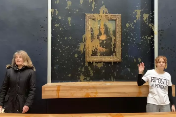 Activists react after throwing soup at the Mona Lisa, Louvre Museum, Paris, France, Jan. 28, 2024. (AP Photo)