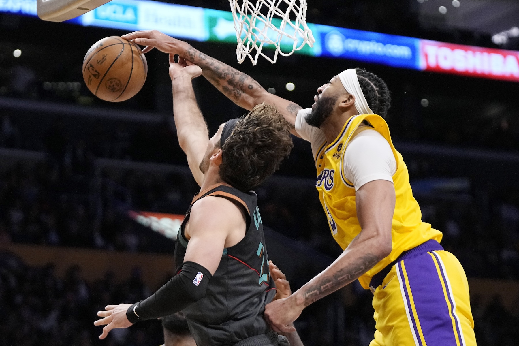 Washington Wizards forward Corey Kispert, left, has his shot blocked by Los Angeles Lakers forward Anthony Davis during the second half of an NBA basketball game Thursday in Los Angeles. (AP)
