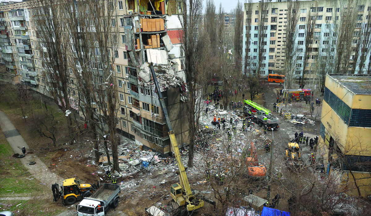 Rescuers work at a site of an apartment building heavily damaged by a drone strike, amid Russia’s attack on Ukraine, in Odesa. (Reuters)