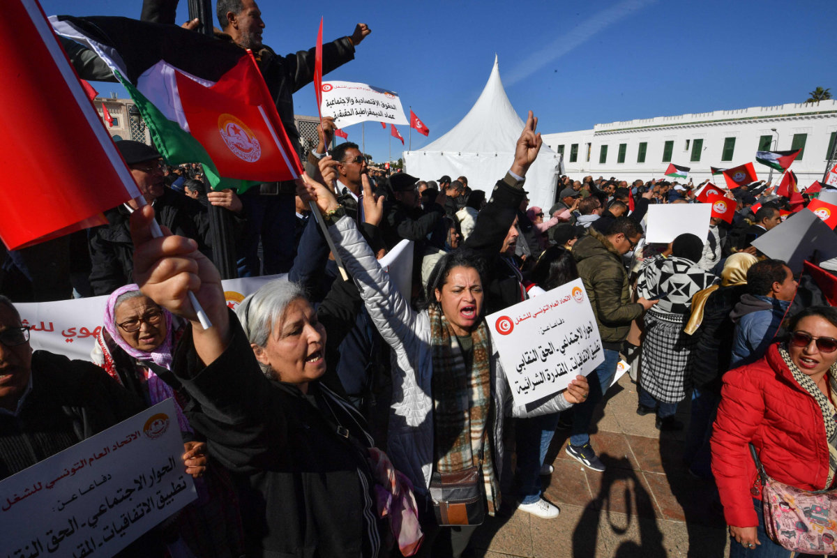 Trade unionists take to the streets in Tunis on March 2, 2024, to protest against a proposed legislation that will grant the government sweeping powers over NGOs. (AFP)