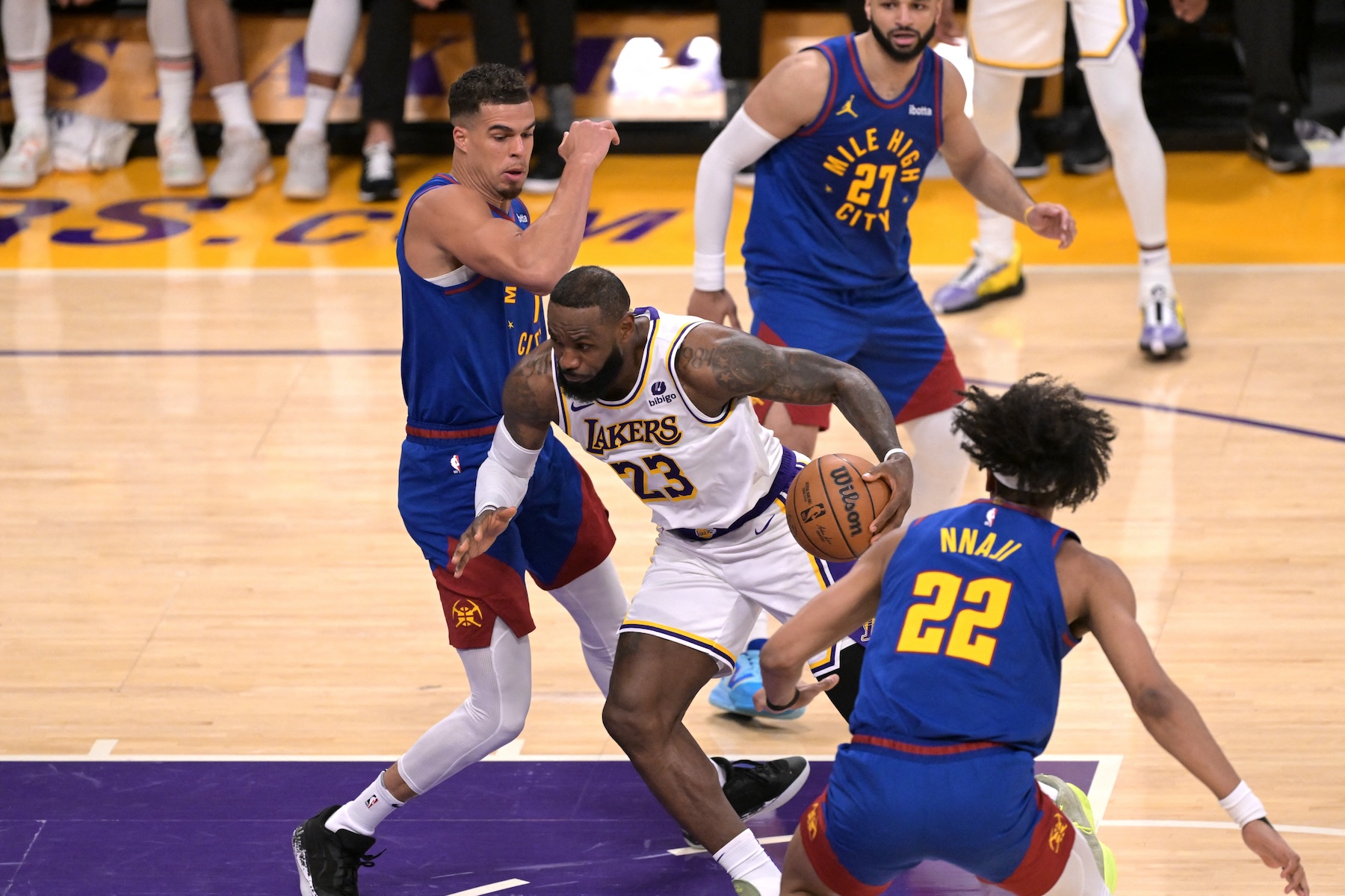 Los Angeles Lakers forward LeBron James (23) drives past Denver Nuggets forward Michael Porter Jr. (1) and forward Zeke Nnaji (22) to score his 40,000th career point during an NBA game Sunday at Crypto.com Arena. (USA TODAY Sports)