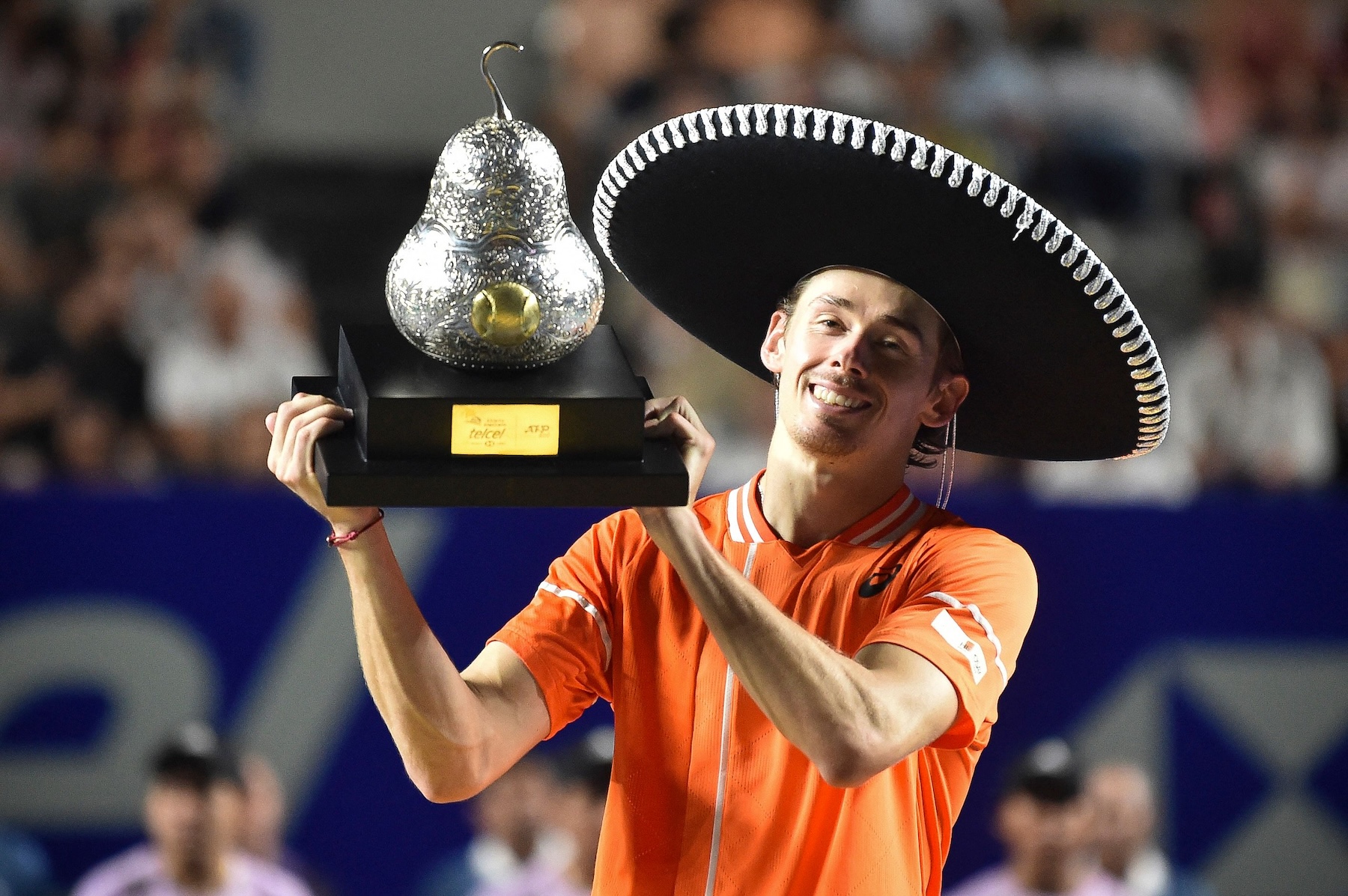 Australia's Alex De Minaur celebrates with his trophy after winning the Mexico ATP Open 500 men's singles final tennis match against Norway's Casper Ruud at the Arena GNP Seguros in Acapulco, Guerrero State, Mexico on March 2, 2024.(AFP)