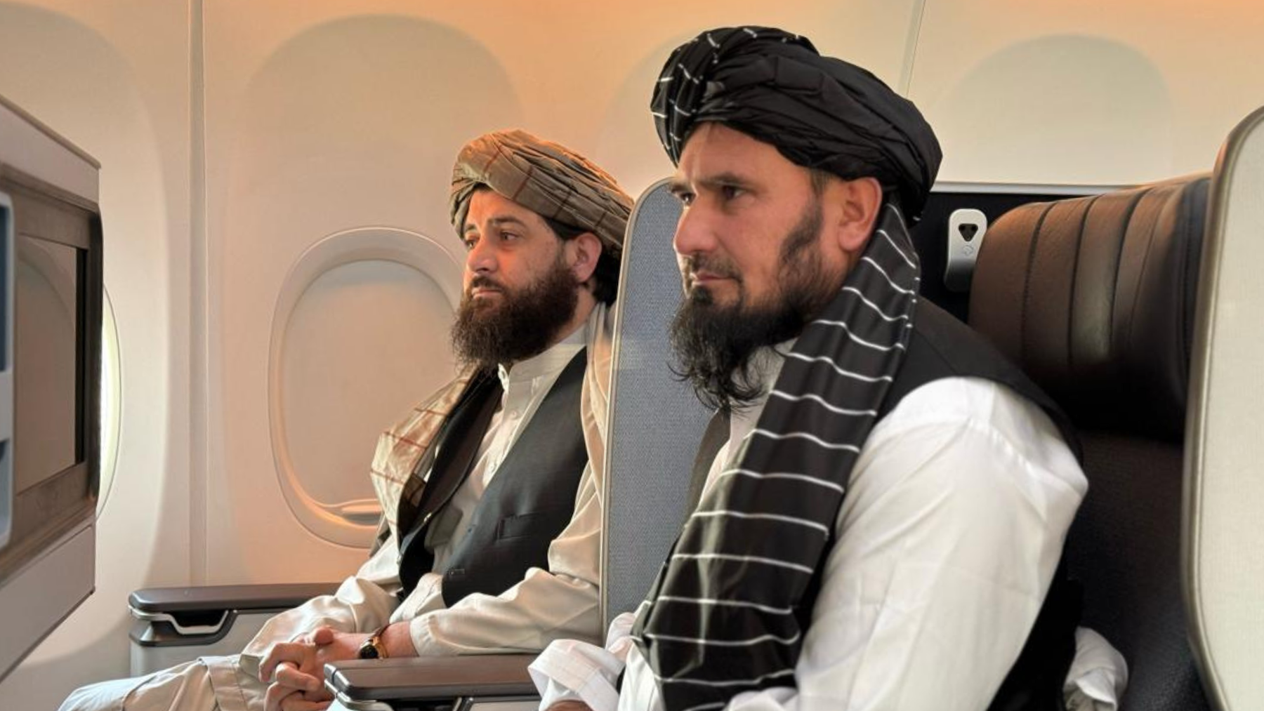 Taliban Defense Minister Mohammad Yaqoob Mujahid and Chief of Army Staff Mohammad Fasihuddin Fitrat sit on a flight to Doha on March 3, 2024. (Afghan Ministry of Defense)
