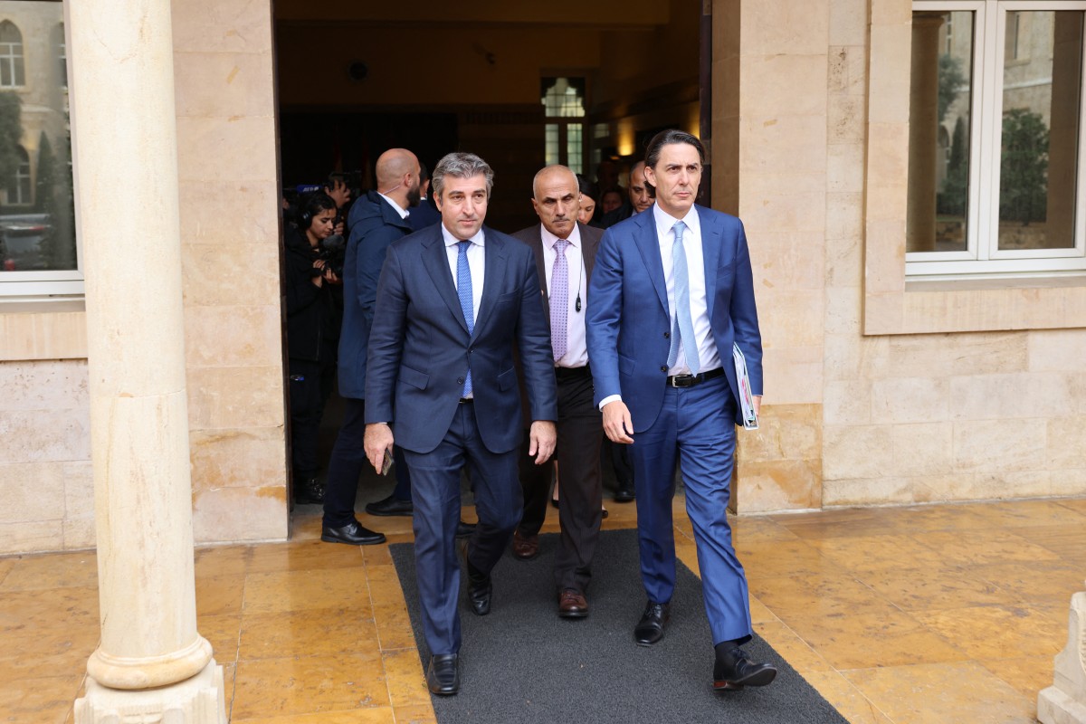 US special envoy Amos Hochstein (R) leaves the government palace in Beirut, accompanied by Lebanese protocal official Lahoud Lahoud (L), after his meeting with Lebanon's caretaker prime minister. (AFP)