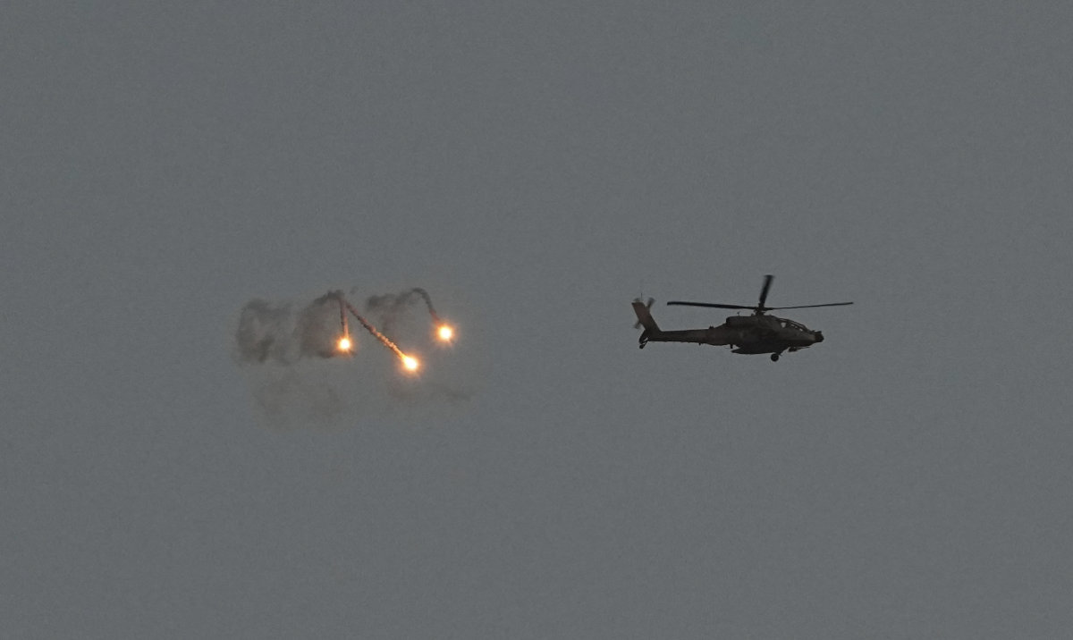 An Israeli Apache helicopter fires flares over the Gaza Strip as seen from southern Israel, Monday, March 4, 2024. The army is battling Palestinian militants across Gaza in the war ignited by Hamas' Oct. 7 attack into Israel. (AP)
