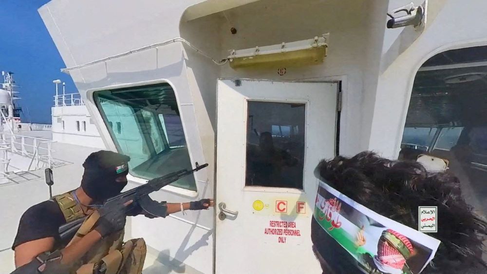 Houthi commandos open the bridge door on the cargo ship Galaxy Leader, Red Sea, Nov. 19, 2023. (Reuters)