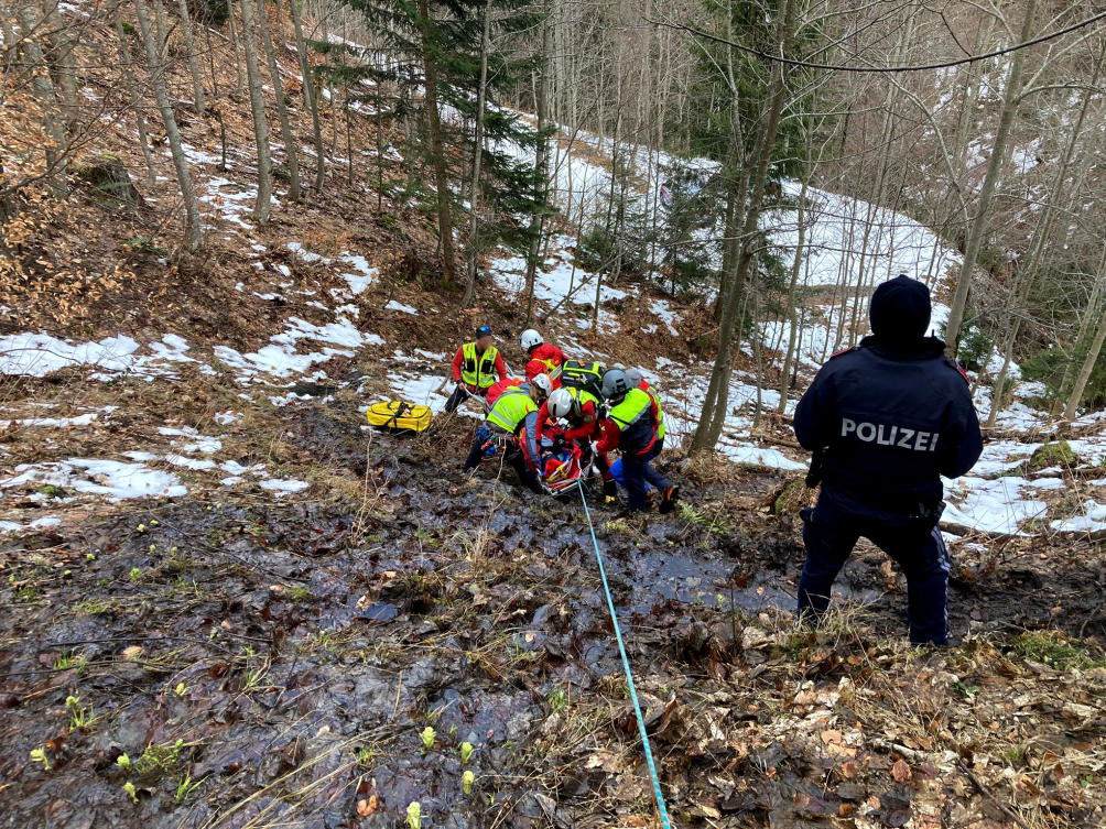 This handout picture taken on Mar. 3, 2024 and released on Mar. 5, 2024 by the Bergrettung Villach Mountain Rescue Service shows a policeman looking on as mountain rescuers save a 14-year-old refugee from Syria after a hiker had heard the calls for help of the boy. (AFP)