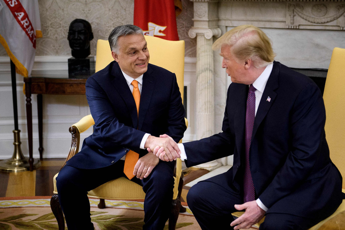 Hungary's Prime Minister Viktor Orban (L) and US President Donald Trump shake hands before a meeting at the White House Min Washington, DC, on ay 13, 2019. (AFP)