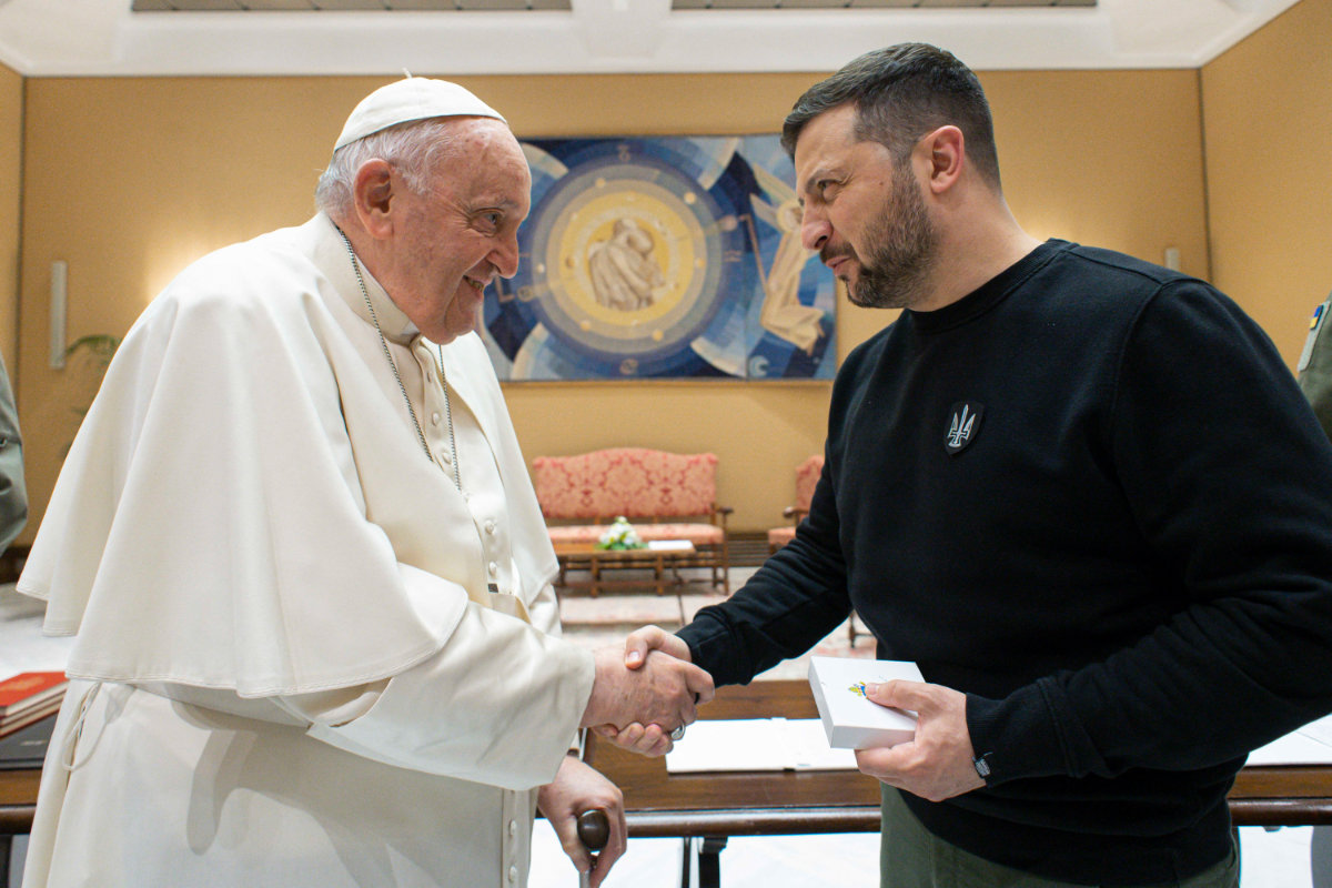 This photo taken and issued as a handout on May 13, 2023 by the Vatican Media shows Pope Francis shake hands with Ukrainian President Volodymyr Zelensky following a private audience in The Vatican. (AFP)