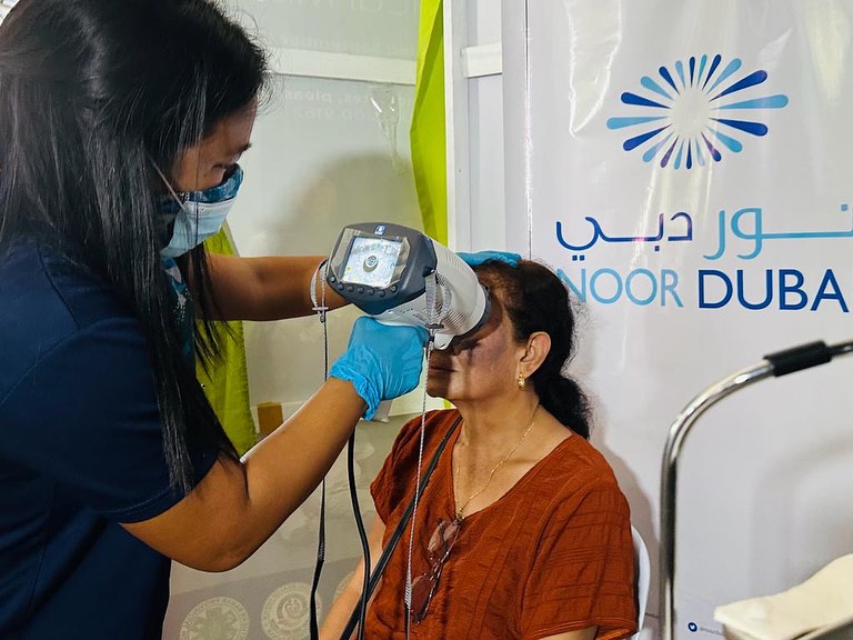 A medical worker conducts an eye care service for a Filipino woman in Catarman, Northern Samar province on Nov. 18, 2023. (Noor Dubai Foundation)