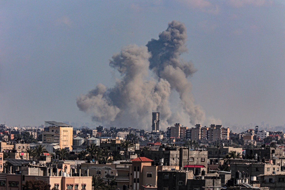 A picture taken from Rafah shows smoke billowing over Khan Yunis in the southern Gaza Strip during Israeli bombardment on March 11 (AFP)