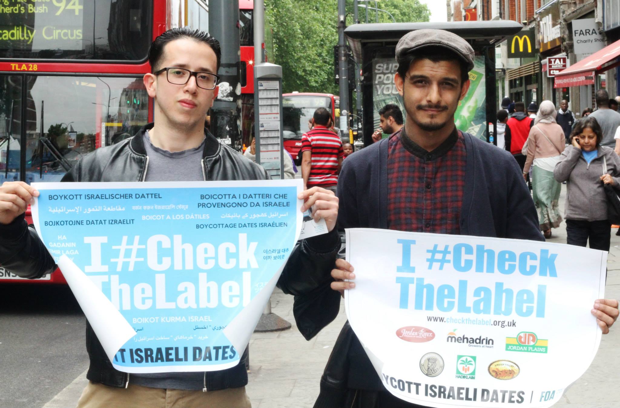 Protesters hold a banner promoting the #CheckTheLabel boycott campaign of Israeli dates in the United Kingdom. (FOA)
