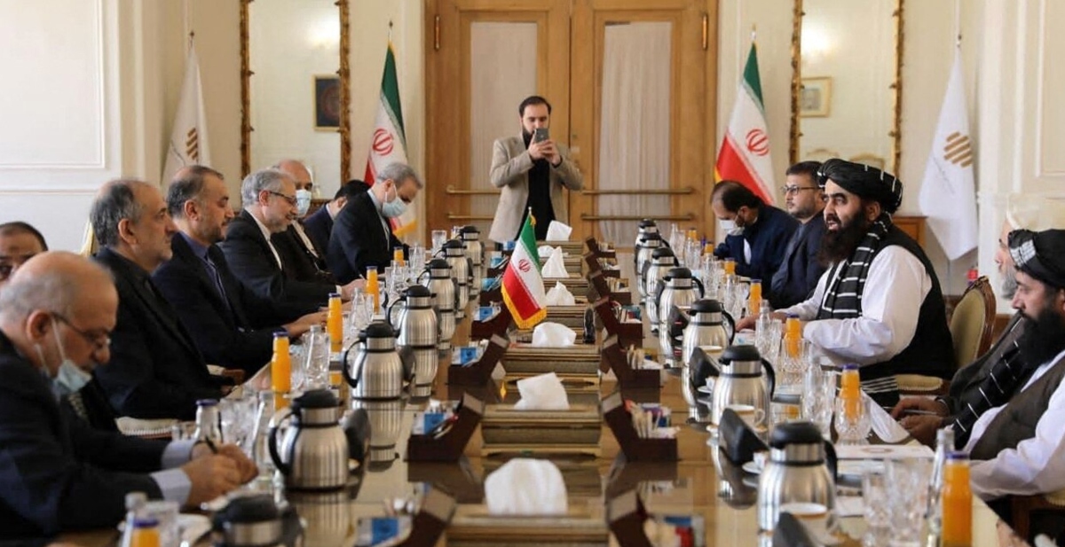 This handout photo provided by the Iranian foreign ministry shows Iranian FM Hossein Amirabdollahian (2nd-L) meeting with acting Taliban Foreign Minister Amir Khan Muttaqi (R) in Tehran, Jan. 9, 2022. (AFP/File)