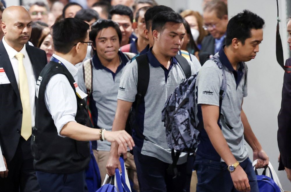 Filipino crewmen, who survived the deadly Houthi attack on the commercial ship ‘True Confidence,’ arrive at Manila International Airport, in Pasay, Metro Manila, Philippines, Mar. 12, 2024. (Reuters)