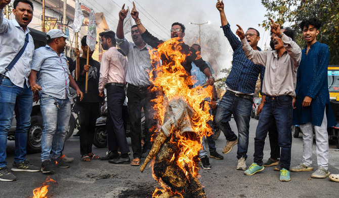 Members of the Asom Jatiyatabadi Yuba Chatra Parishad (AJYCP), a student's organisation, burn the effigy of India's Prime Minister Narendra Modi during a protest against the implementation of the Citizenship Amendment Act (CAA) in Guwahati on March 12, 2024. (AFP)