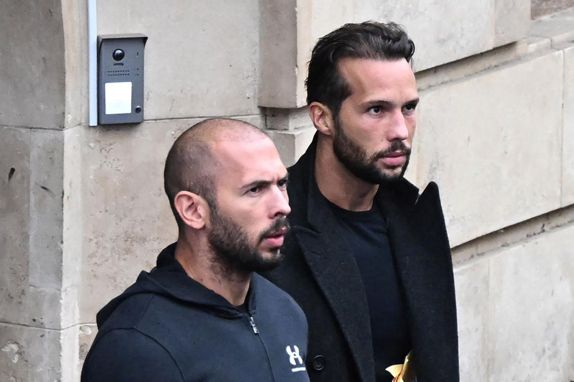 This file photo taken on Jan. 10, 2023 shows British-US former professional kickboxer and controversial influencer Andrew Tate (L) and his brother Tristan Tate (R) exiting a court in Bucharest, Romania. (AFP)