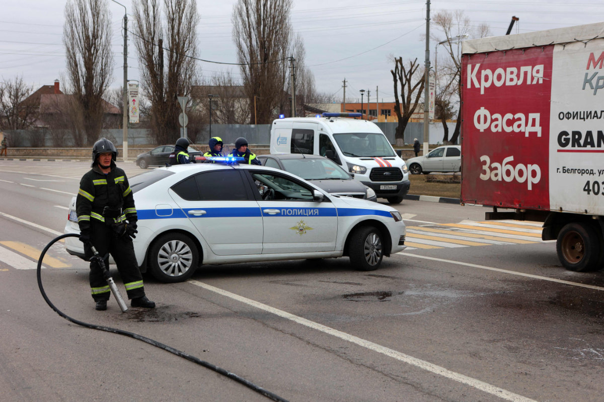 Russian police and firefighters respond at the scene of fresh aerial attacks on Belgorod on March 14, 2024. (AFP)