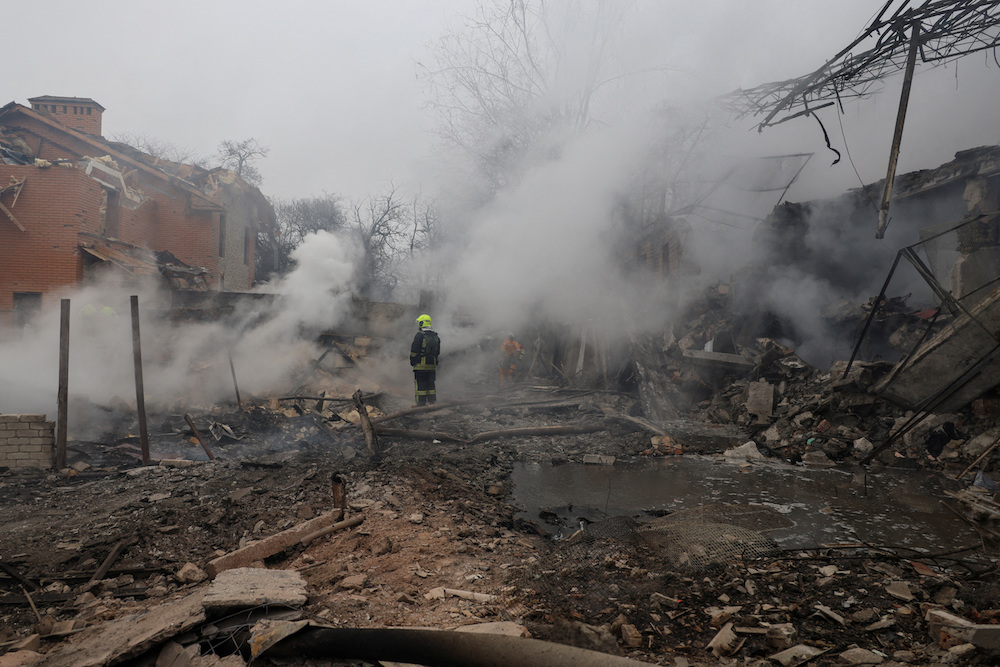 rescuer stands in a residential area hit by a Russian missile strike, amid Russia's attack on Ukraine, in Odesa, Ukraine March 15, 2024. (Reuters)