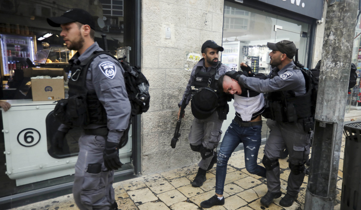 Israeli police arrests a Palestinian during a protest demanding a release of Heba al-Labadi, a Jordanian citizen of Palestinian descent, in east Jerusalem, Saturday, Oct. 26, 2019. (AP)