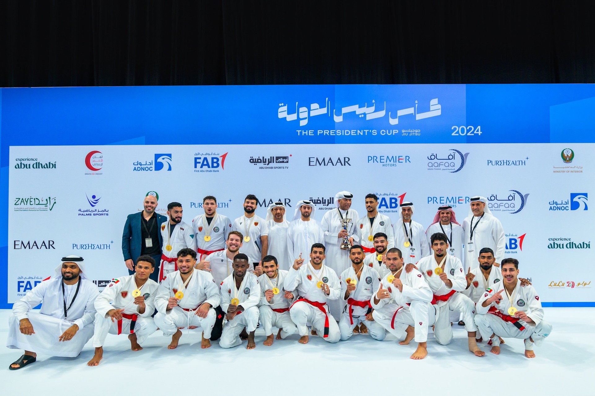 Al-Wahda's men celebrate winning the Jiu-Jitsu President’s Cup in Abu Dhabi. (UAEJJF)