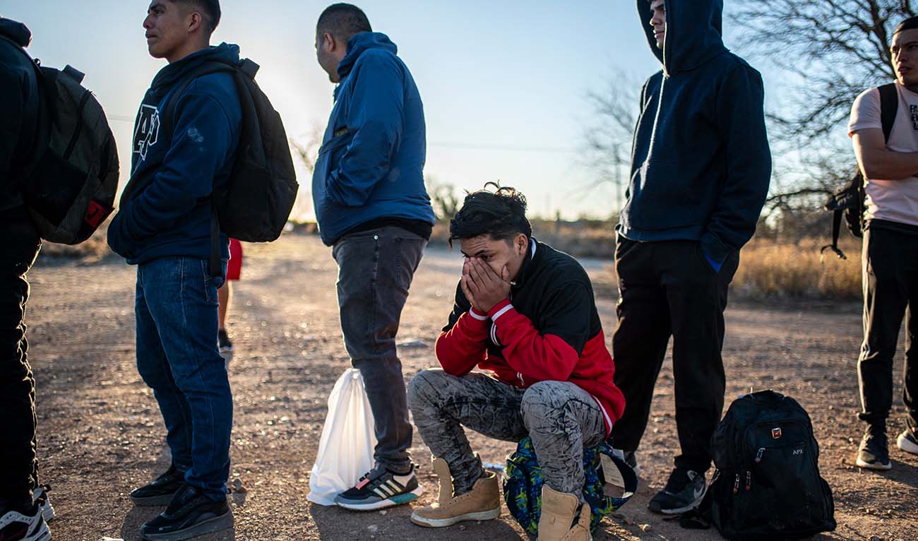 A group of migrants are processed by Border Patrol after crossing the river illegally near the highway on February 4, 2024 outside Eagle Pass, Texas. (AFP/File)