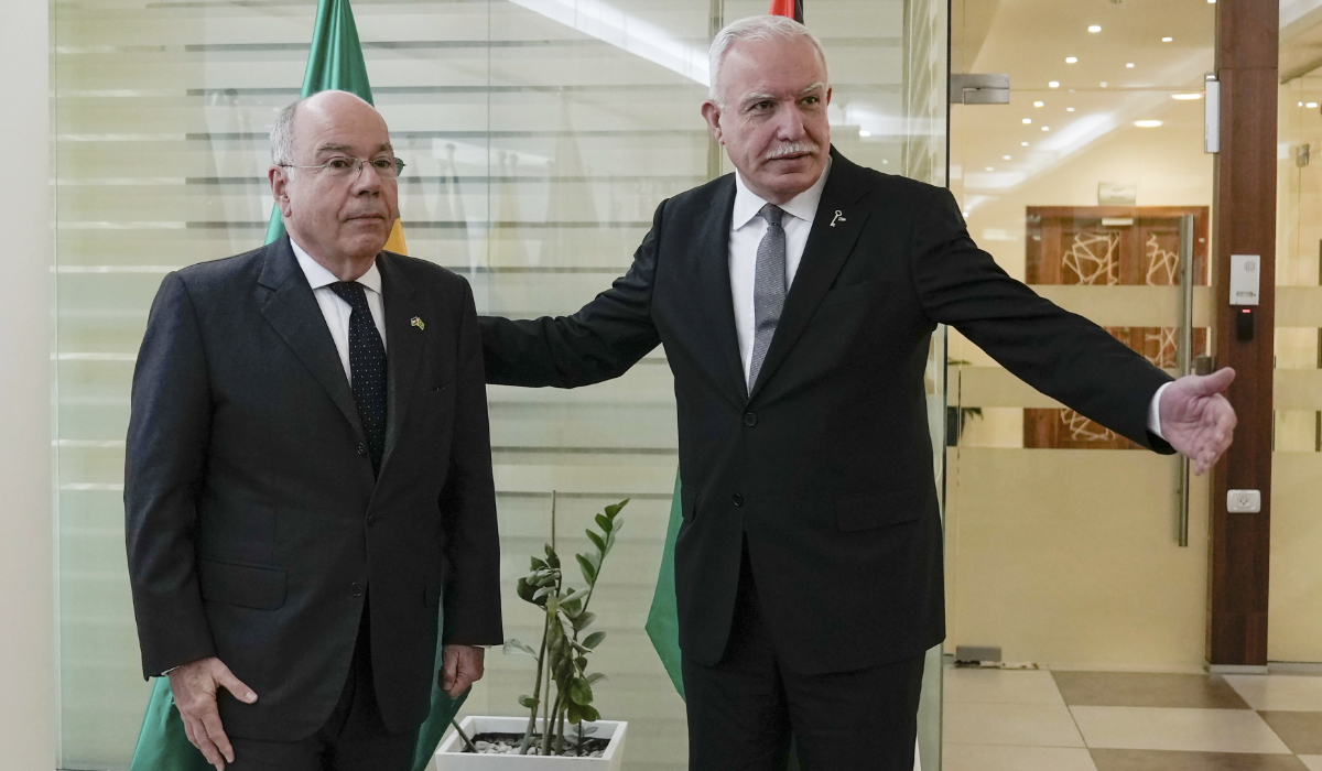 Palestinian Foreign Minister Riyad al-Maliki welcomes his Brazilian counterpart Mauro Vieira to his office in the West Bank city of Ramallah, Sunday, March 17, 2024. (AP)