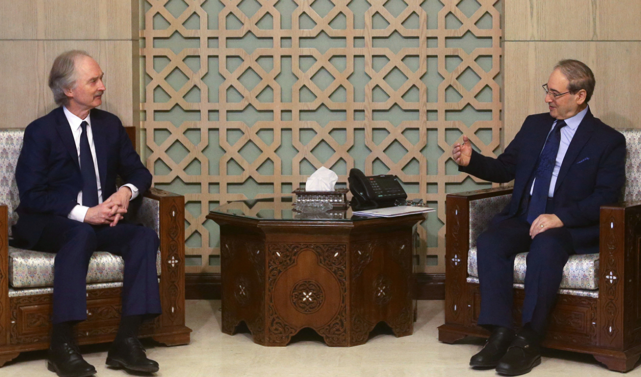 Syria’s Foreign Minister Faisal Miqdad (R) meets with United Nations Special Envoy for Syria Geir Pedersen in Damascus on March 17, 2024. (AFP)