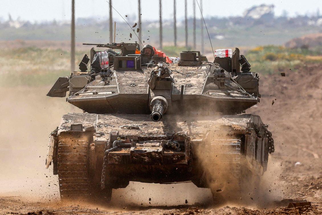 This picture taken from Israel’s southern border with the Gaza Strip shows Israeli army battle tank moving at a position along the border with the Palestinian territory on Mar. 19, 2024. (AFP)