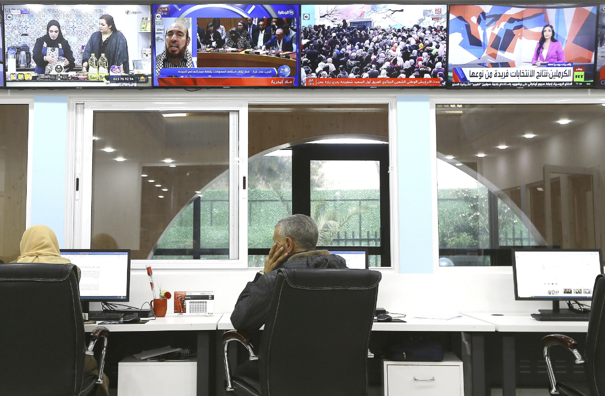 Journalists work at a private television broadcaster in Algiers, Tuesday, March 19, 2024. (AP)
