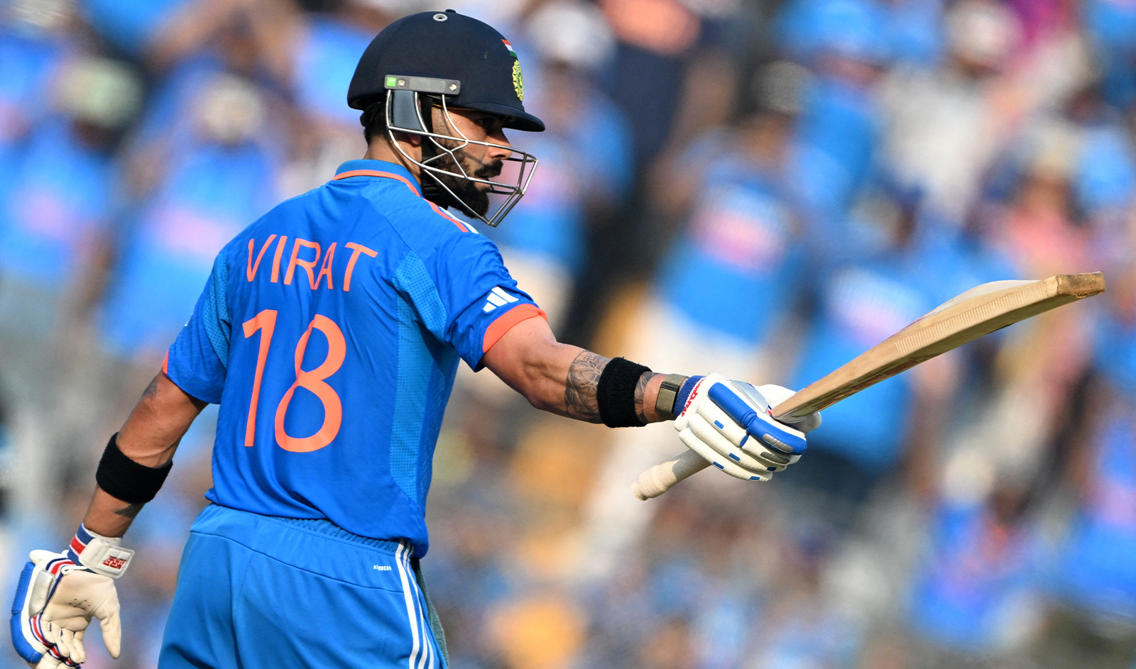 India's Virat Kohli celebrates after scoring a half-century (50 runs) during the 2023 ICC Men's Cricket World Cup one-day international (ODI) first semi-final match between India and New Zealand at the Wankhede Stadium in Mumbai on November 15, 2023. (AFP/File)
