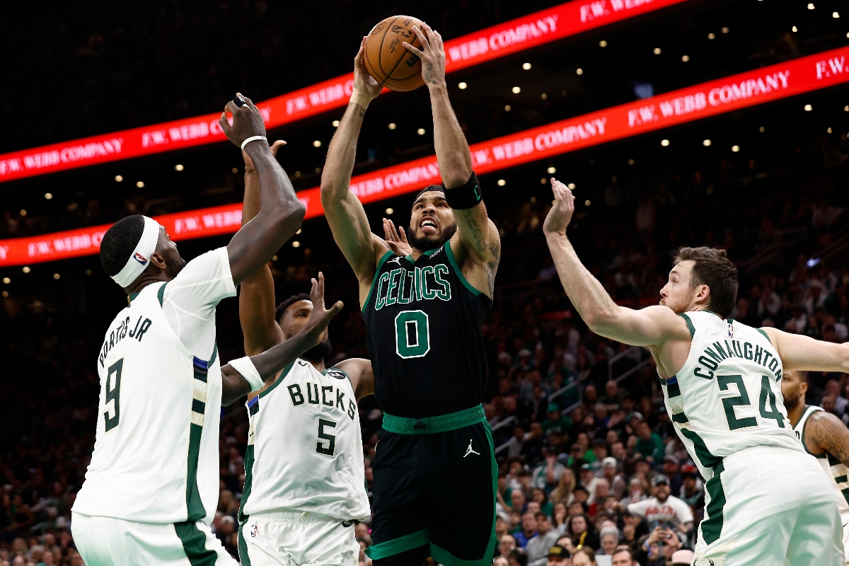 Boston Celtics forward Jayson Tatum goes to the basket between Milwaukee Bucks guard Pat Connaughton (24) and forward Bobby Portis (9) during the second half of an NBA game at TD Garden Wednesday. (USA TODAY Sports)