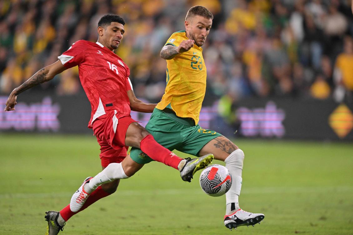 Lebanon’s Walid Shour (L) and Australia’s Adam Taggart (R) compete for the ball during their FIFA World Cup 2026 qualifier match at CommBank Stadium in Sydney on Mar. 21, 2024. (AFP)