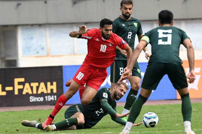 Jordan’s Mousa Al Tamari (L) and Pakistan’s Alamgir Ali Khan ((2L) fight for the ball during the 2026 FIFA World Cup qualifier football match between Pakistan and Jordan at the Jinnah Sports stadium in Islamabad on March 21, 2024. (AFP)