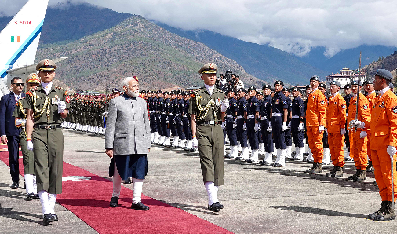 India's Prime Minister Narendra Modi (4L) arrives at Paro International Airport in Paro on March 22, 2024. (AFP)