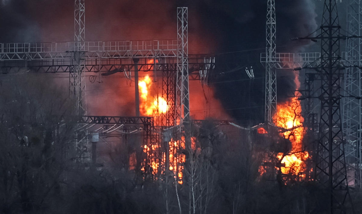 Smoke and fire are seen around high-voltage lines at a site of a Russian missile strike outside Kharkiv on Mar. 22, 2024. (Reuters)