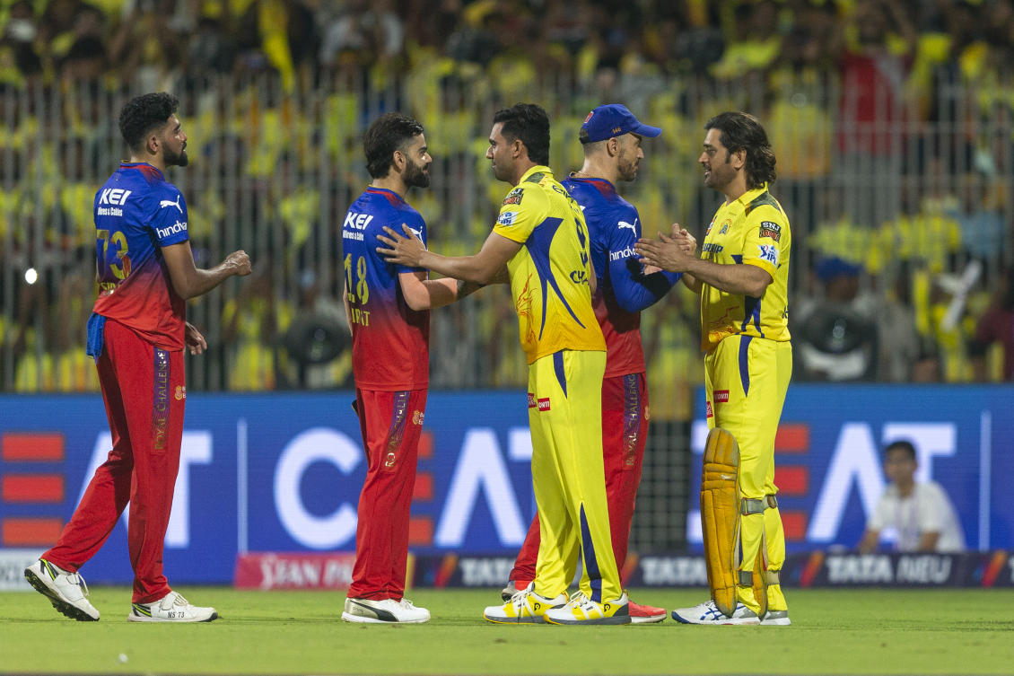 Chennai Super Kings’ MS Dhoni, right, shakes hands with Royal Challengers Bengaluru’s captain Faf du Plessis, and Chennai Super Kings’ Shivam Dube with Royal Challengers Bengaluru’s Virat Kohli, after Chennai Super Kings won the match. (AP)
