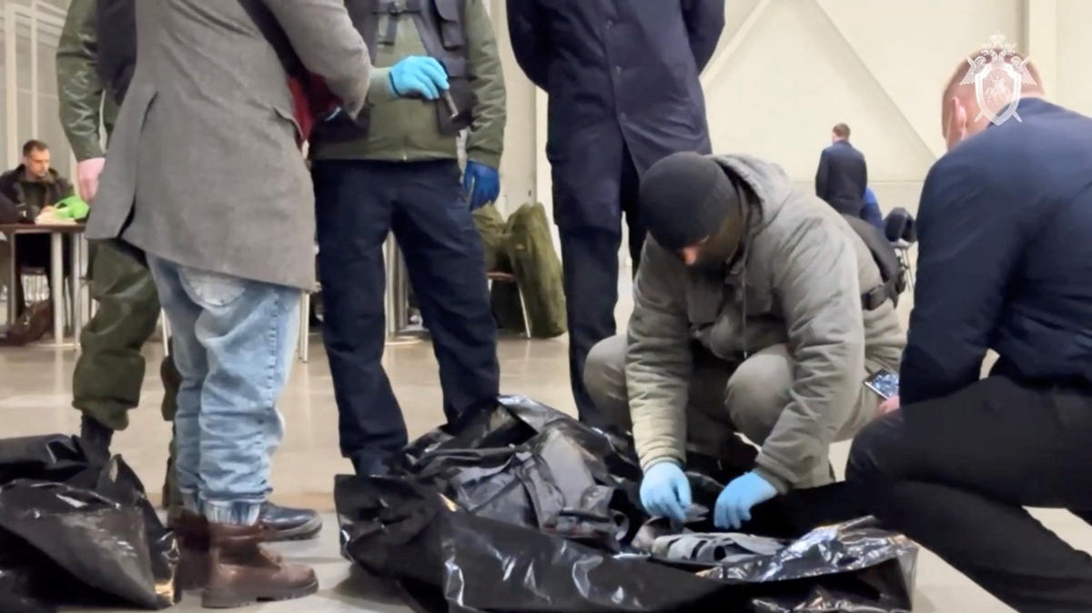 Members of the Investigative Committee of Russia examine the ammunition at the scene of the deadly shooting attack in Crocus City Hall concert venue, in the Moscow Region, on Mar. 23, 2024, in this still image taken from a handout video. (Reuters)