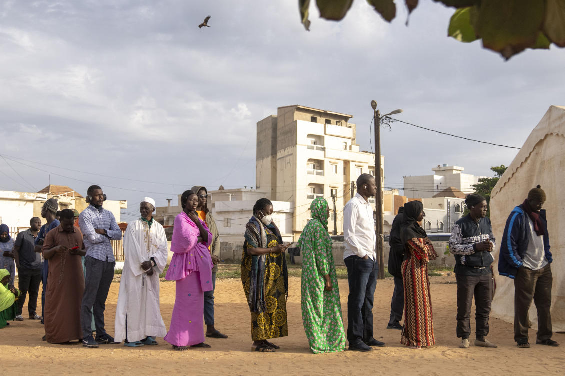 People wait to cast their votes outside a polling station during the presidential elections, in Dakar, Senegal, Sunday, March 24, 2024. (AP)
