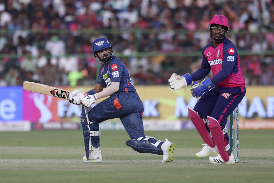 Rajasthan Royals’ captain and wicketkeeper Sanju Samson, right, reacts after Lucknow Super Giants’ captain KL Rahul, left, played a shot during the Indian Premier League cricket match between Rajasthan Royals and Lucknow Super Giants in Jaipur, India, Sunday, March 24, 2024. (AP)
