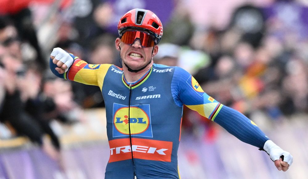 Trek’s Dane rider Mads Pedersen celebrates as he crosses the finish line to win the Cycling World Tour Gent-Wevelgem men’s 253,1 km race from Ieper to Wevelgem, on March 24, 2024. (AFP)