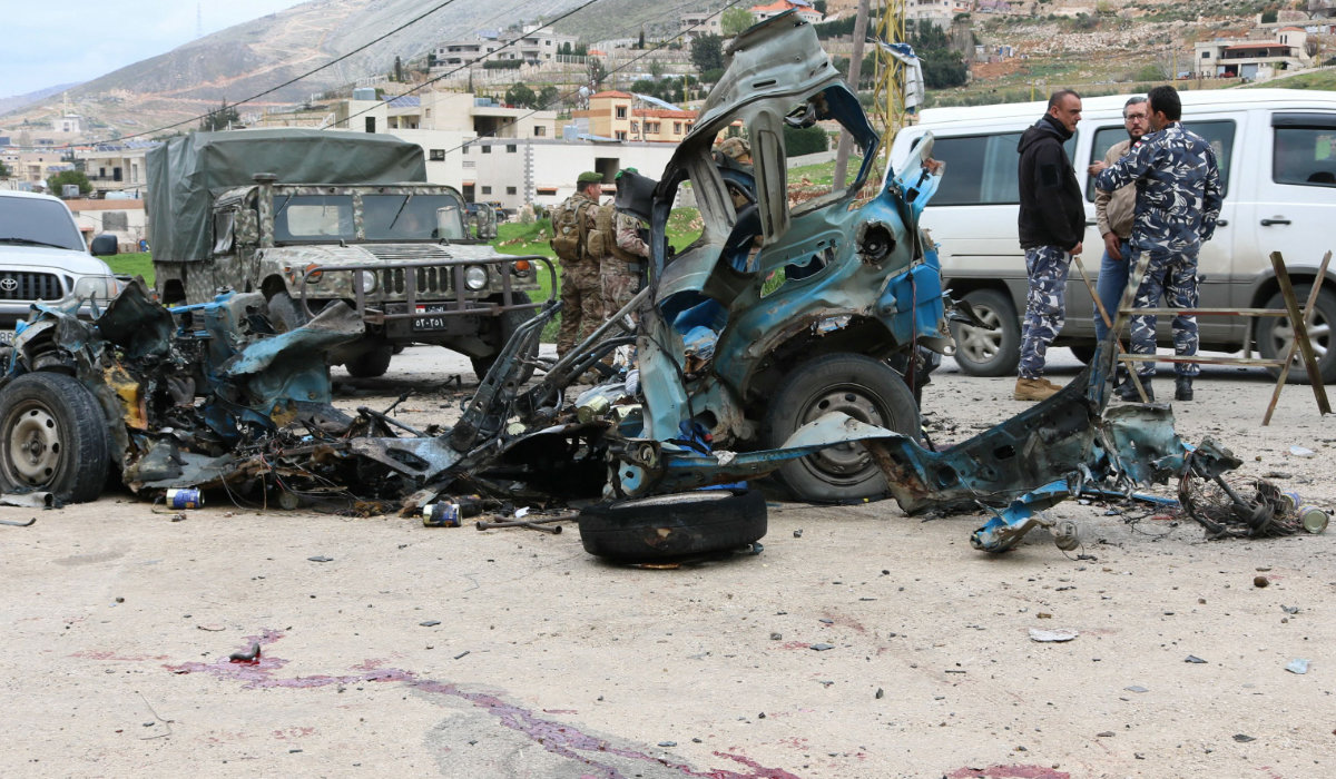 Lebanese soldiers cordon off the site of an Israeli drone attack targeting a vehicle in the town of Souairi, in western Bekaa Valley in central Lebanon on March 24, 2024, amid ongoing cross-border tensions as fighting continues between Israel and Hamas militants in the Gaza Strip. (AFP)