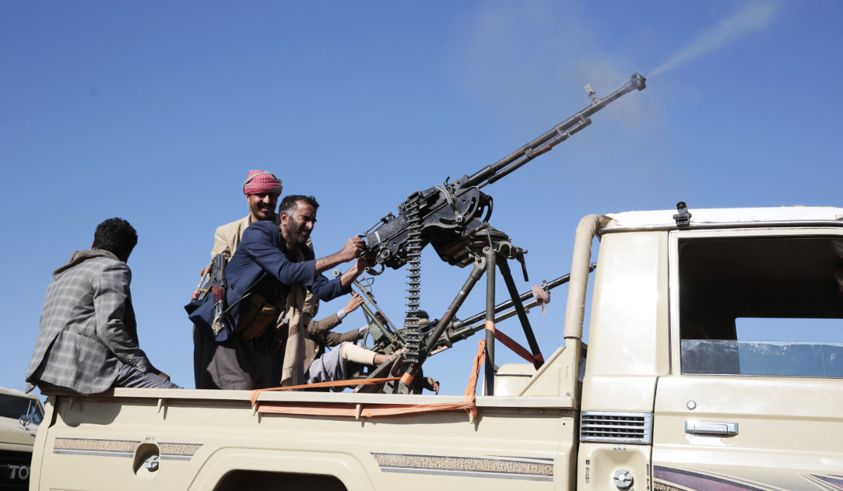 Houthi fighters stage a rally against the US government designating Houthis as a terror group and against the U.S.-led sustained airstrikes on Yemen, near Sanaa, Yemen. (AP file photo)