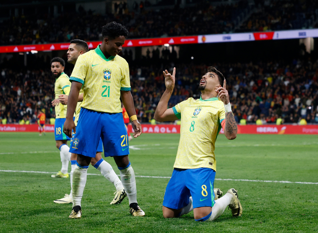 Brazil’s Lucas Paqueta celebrates scoring their third goal with Endrick during the “One Skin” international friendly football match between Spain and Brazil at the Santiago Bernabeu stadium in Madrid. (Reuters)