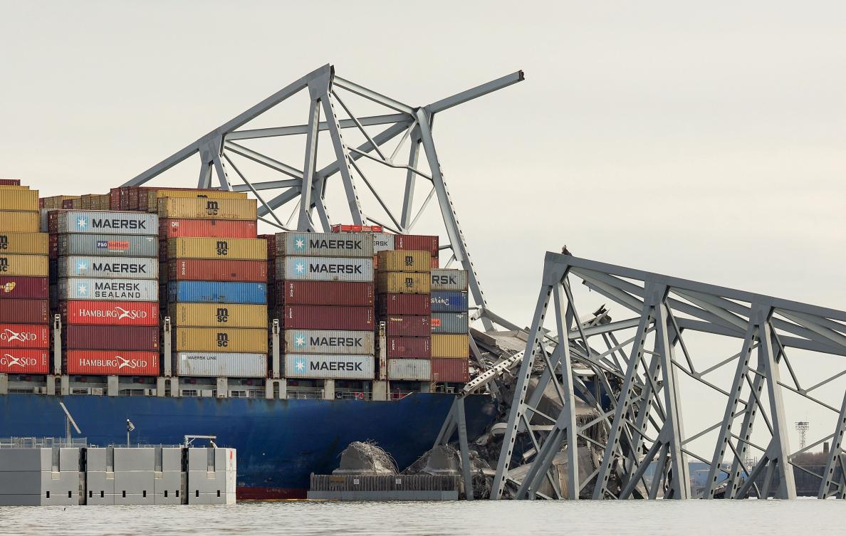 A work crew was fixing potholes on the bridge, which is used by roughly 30,000 people each day, when the ship struck. (Kevin Dietsch/Getty Images/AFP)