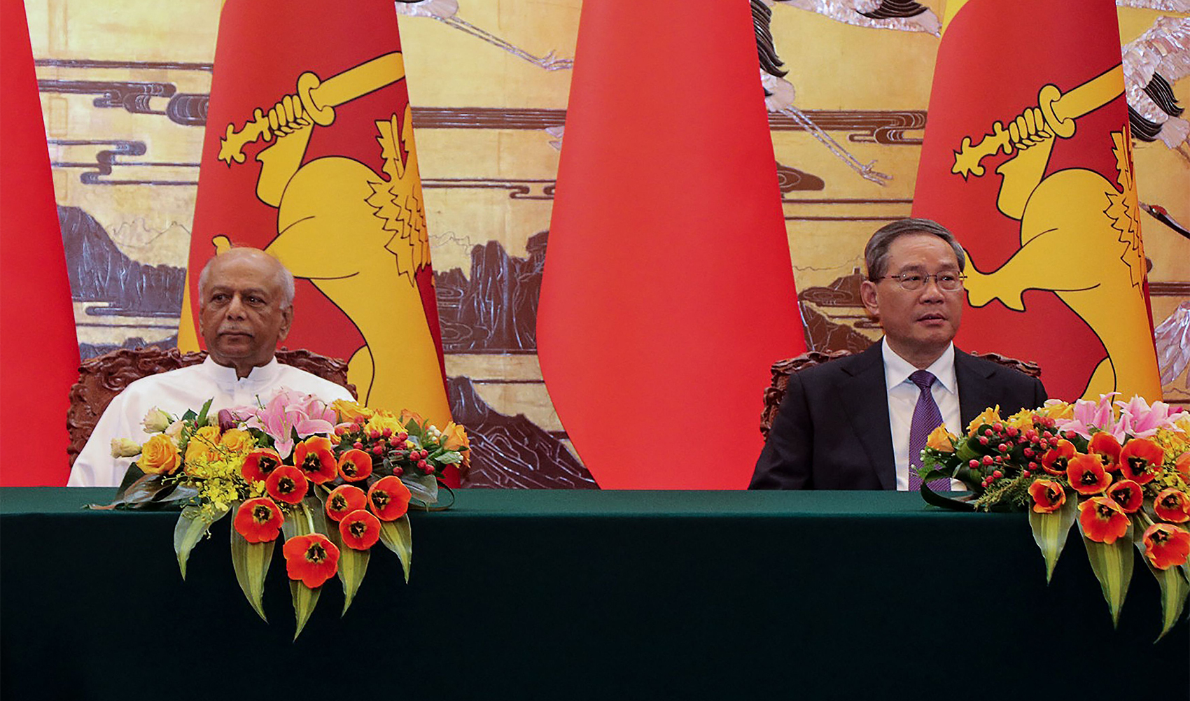 In this handout photograph released by the Sri Lanka Prime Minister's Office and taken on March 27, 2024 shows Sri Lanka's Prime Minister Dinesh Gunawardena (L) and China's Premier Li Qiang during bilateral talks in Beijing. (AFP /Sri Lanka Prime Minister's Office)