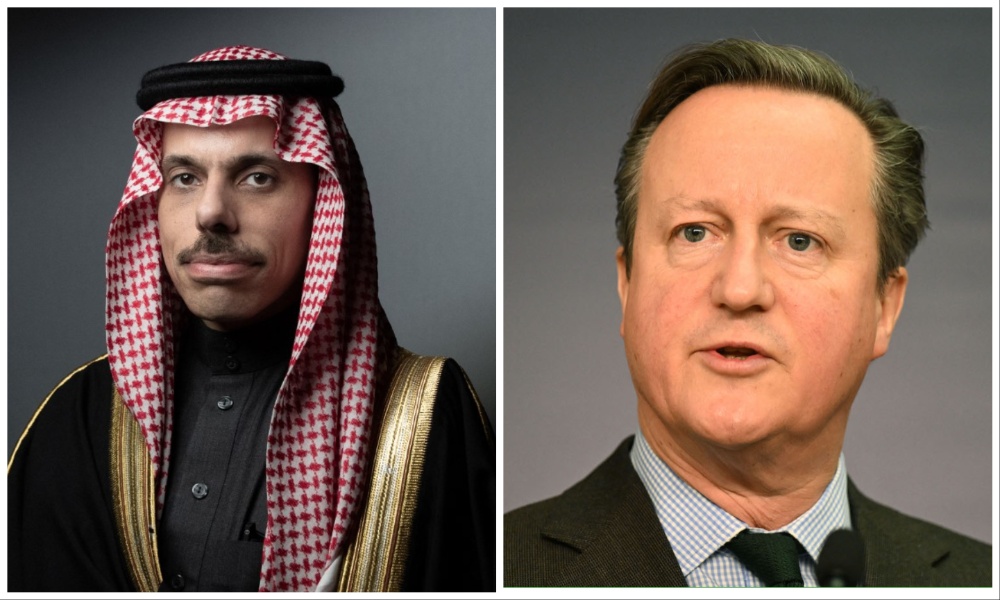 Saudi Arabia’s Foreign Minister Prince Faisal bin Farhan and British Foreign Secretary David Cameron. (File/AFP)