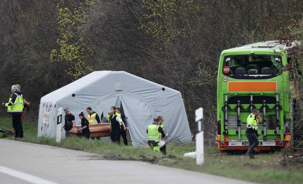 Funerary service officers carry out the coffin of a victim at the scene of a bus accident on the A9 highway, where at least five people were killed, on Mar. 27, 2024 in Schkeuditz, near Leipzig, eastern Germany. (AFP)